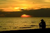 lonely-man-silhouette-sea-sunset-koh-chang-thailand-31513456